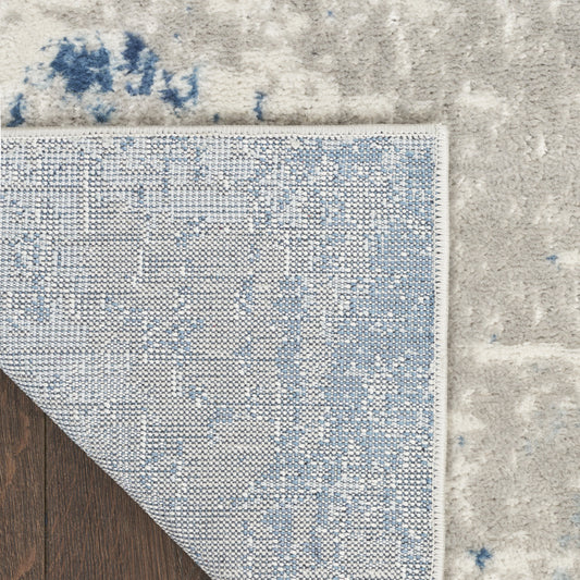7' x 10' Blue and Gray Abstract Power Loom Area Rug