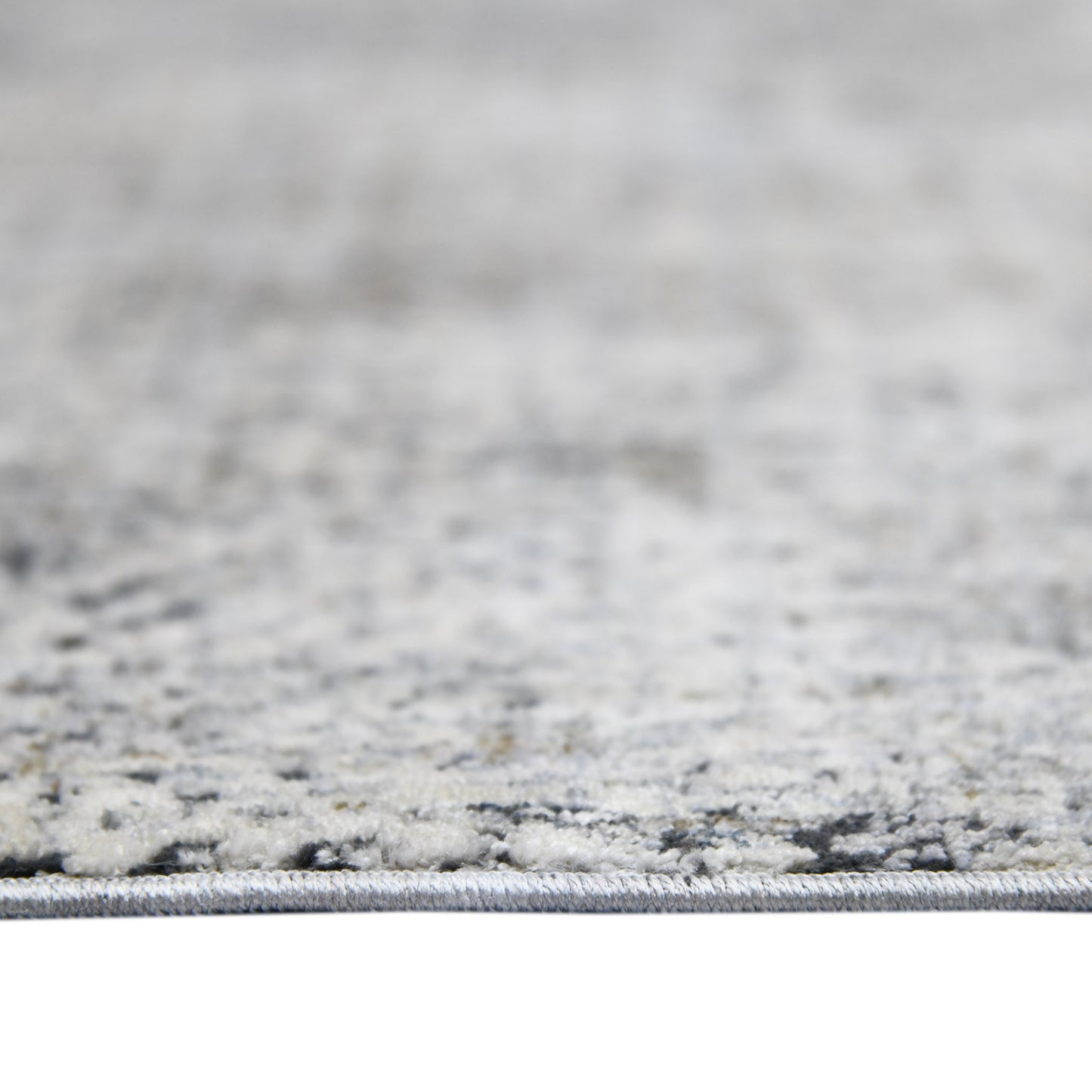 5' x 8' Gray and Ivory Abstract Power Loom Area Rug