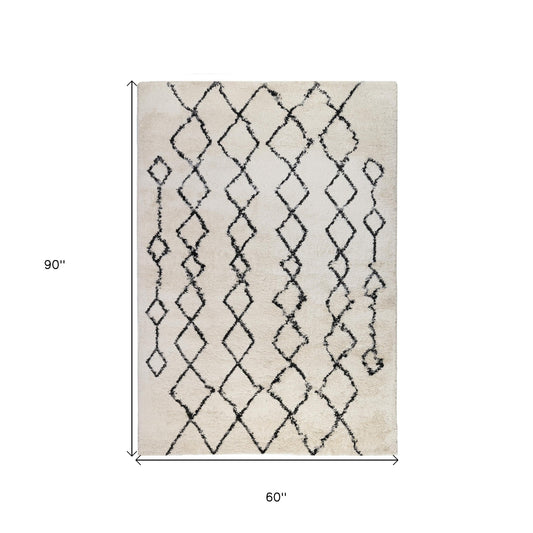 5' x 8' Gray and Ivory Geometric Shag Area Rug