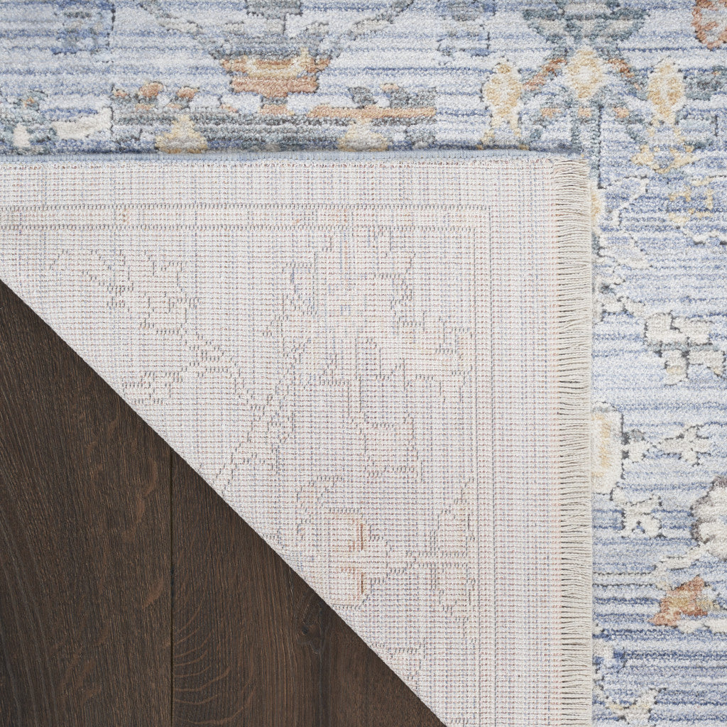 8' x 10' Blue and Ivory Oriental Power Loom Distressed Area Rug With Fringe