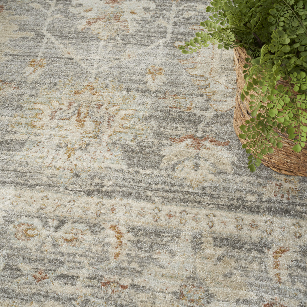 5' x 8' Beige Ivory and Gray Oriental Power Loom Distressed Area Rug With Fringe