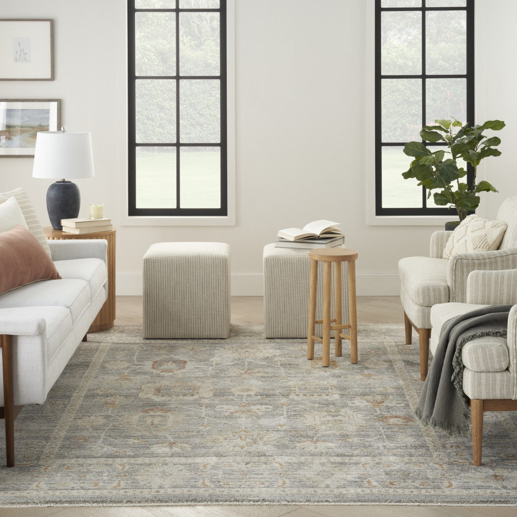 5' x 8' Beige Ivory and Gray Oriental Power Loom Distressed Area Rug With Fringe
