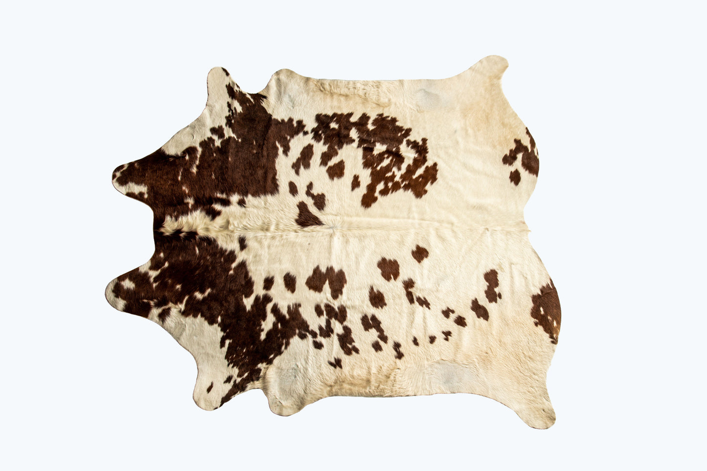 5' x 7' Brown and White Cowhide Hand Knotted Area Rug