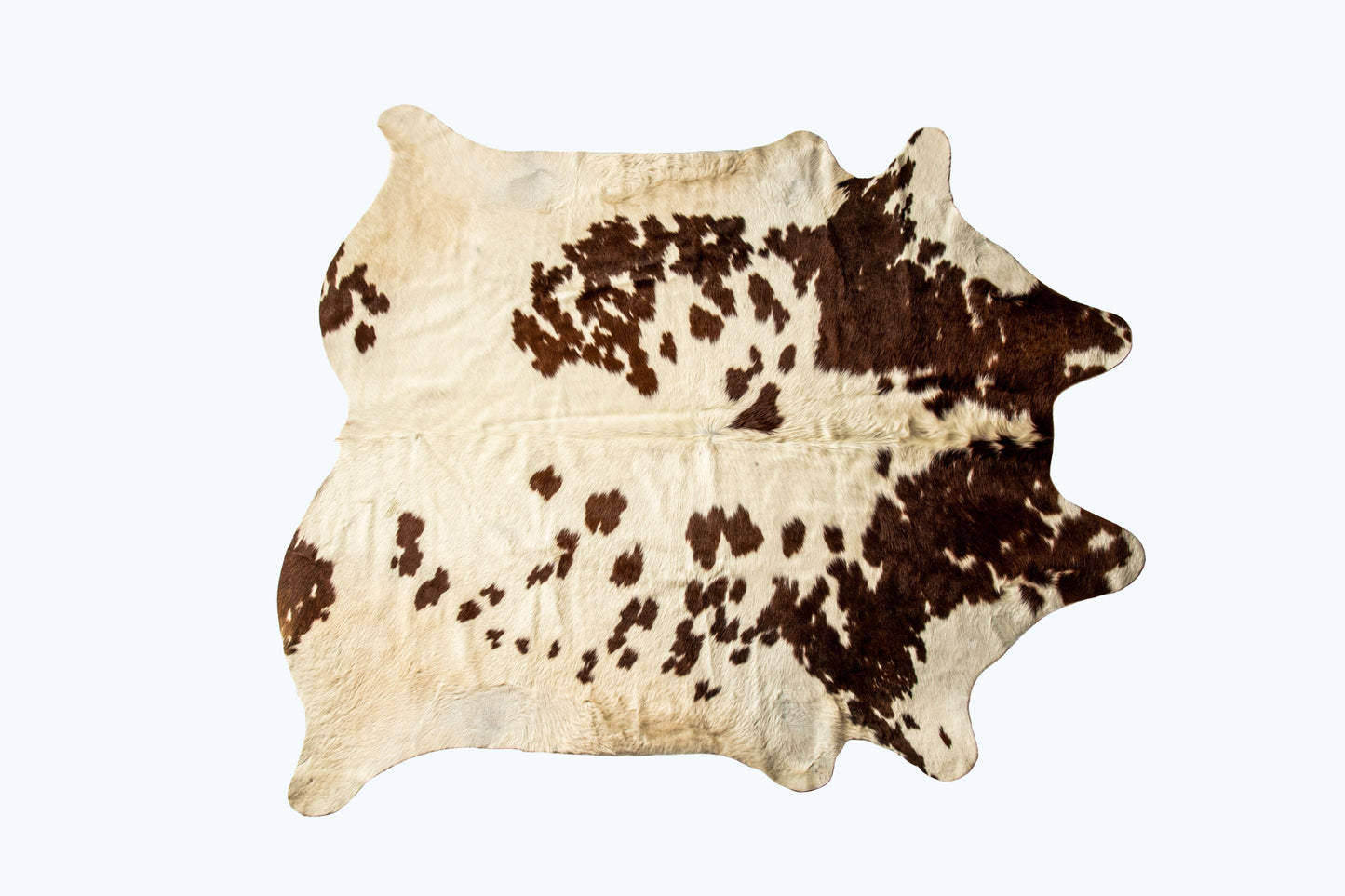 5' x 7' Brown and White Cowhide Hand Knotted Area Rug