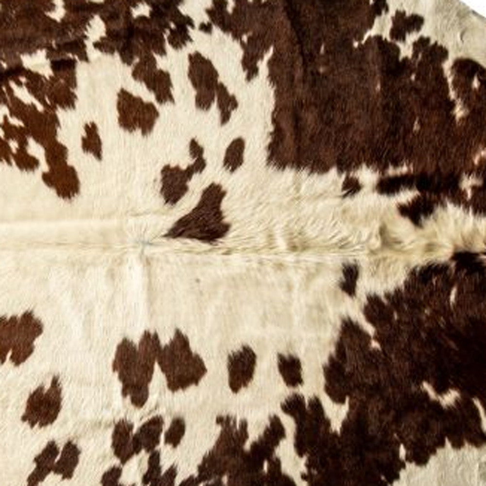5' x 7' Brown and White Cowhide Hand Knotted Area Rug