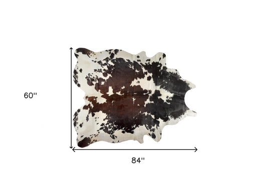 5' x 7' Brown and White Cowhide Hand Knotted Area Rug