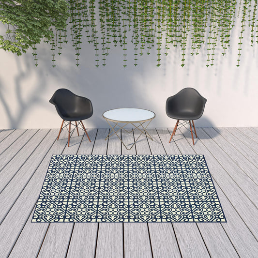 7' x 10' Ivory and Blue Geometric Stain Resistant Indoor Outdoor Area Rug