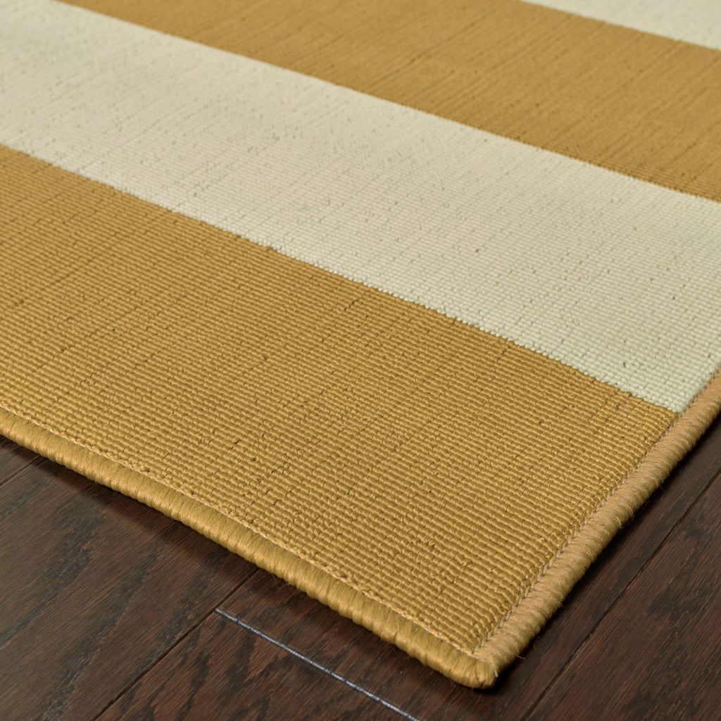 5' x 8' Gold and Ivory Geometric Stain Resistant Indoor Outdoor Area Rug