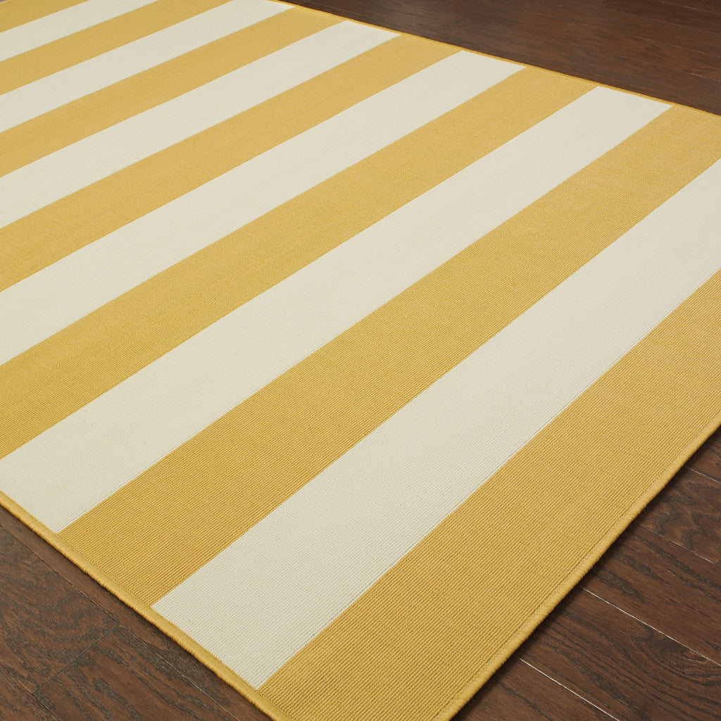 5' x 8' Gold and Ivory Geometric Stain Resistant Indoor Outdoor Area Rug
