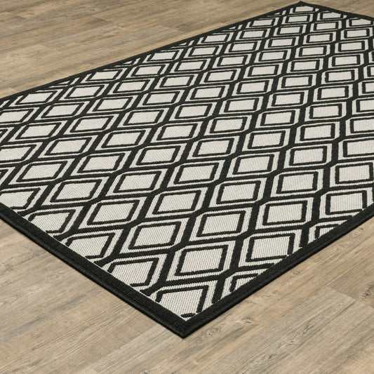 5' x 7' Beige and Black Geometric Stain Resistant Indoor Outdoor Area Rug