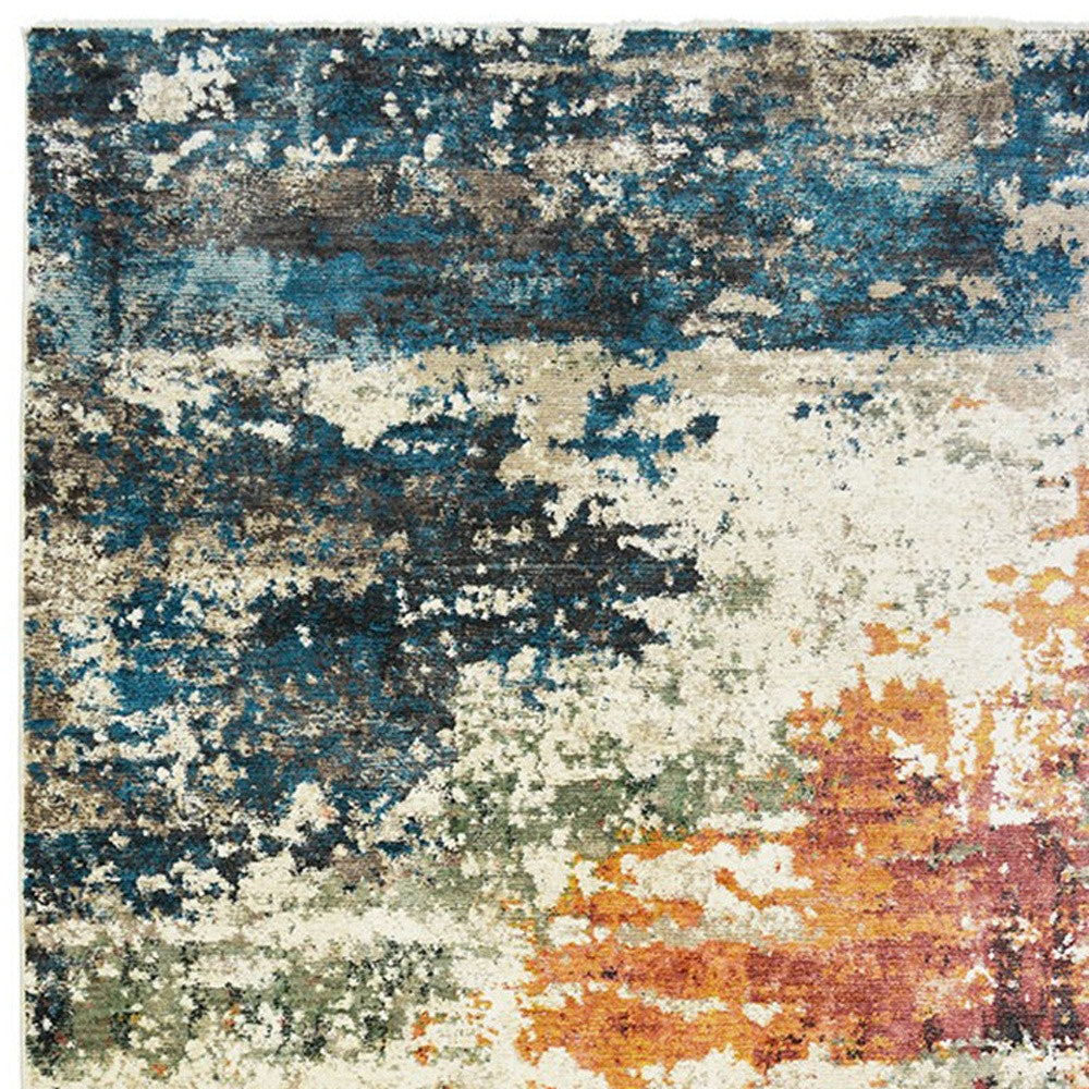 5' x 8' Beige Blue and Ivory Abstract Distressed Area Rug With Fringe