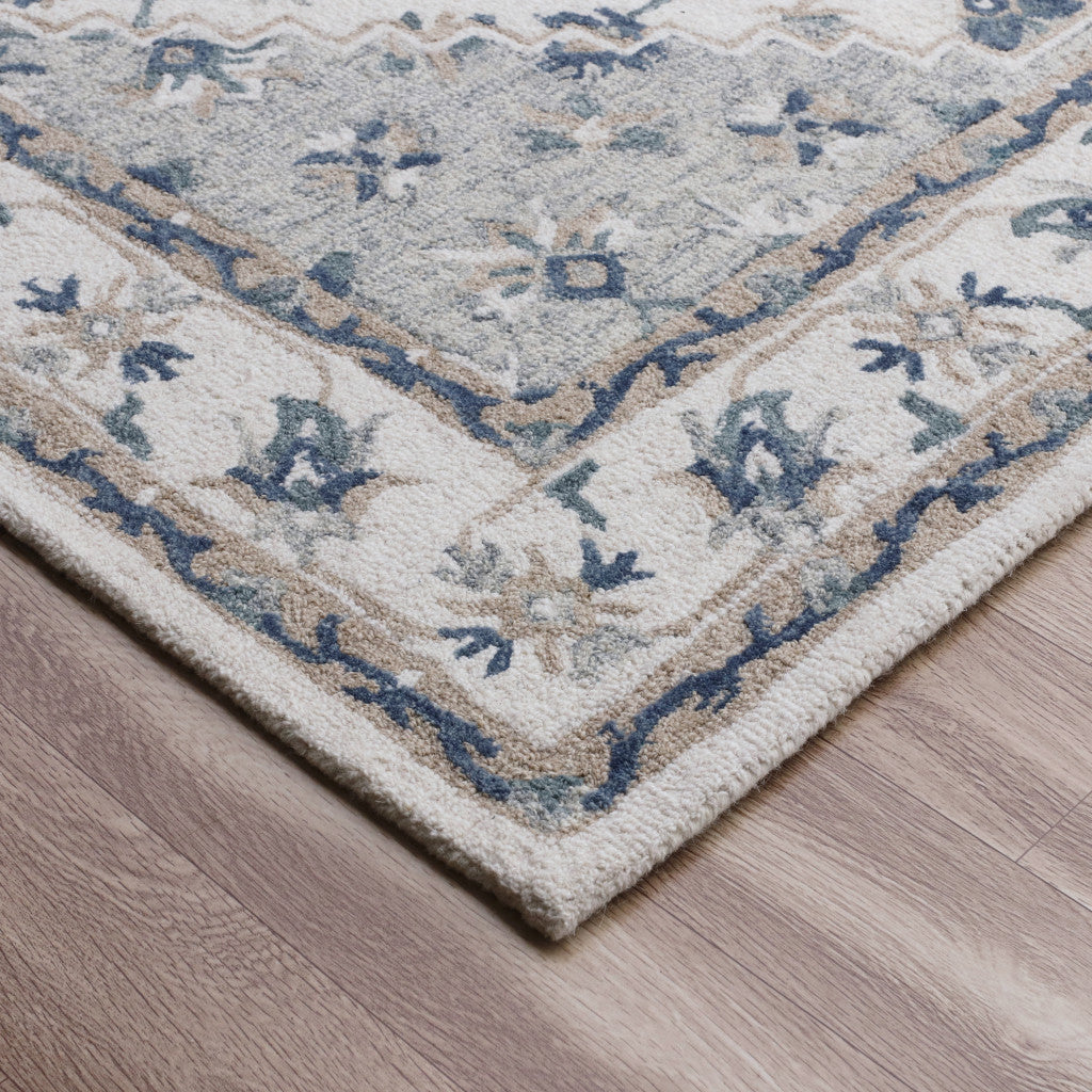 5' x 8' Blue and Ivory Wool Floral Hand Tufted Area Rug