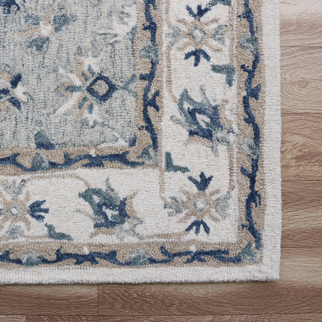 5' x 8' Blue and Ivory Wool Floral Hand Tufted Area Rug