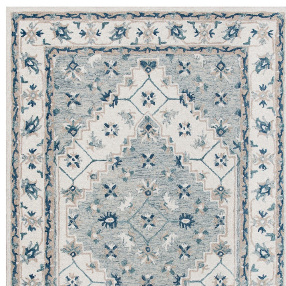 5' x 8' Blue and Ivory Wool Floral Hand Tufted Area Rug