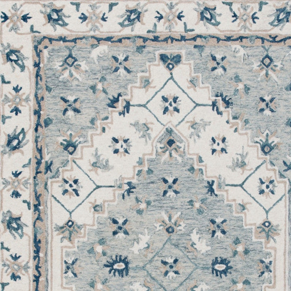 5' x 8' Blue and Ivory Wool Floral Hand Tufted Area Rug