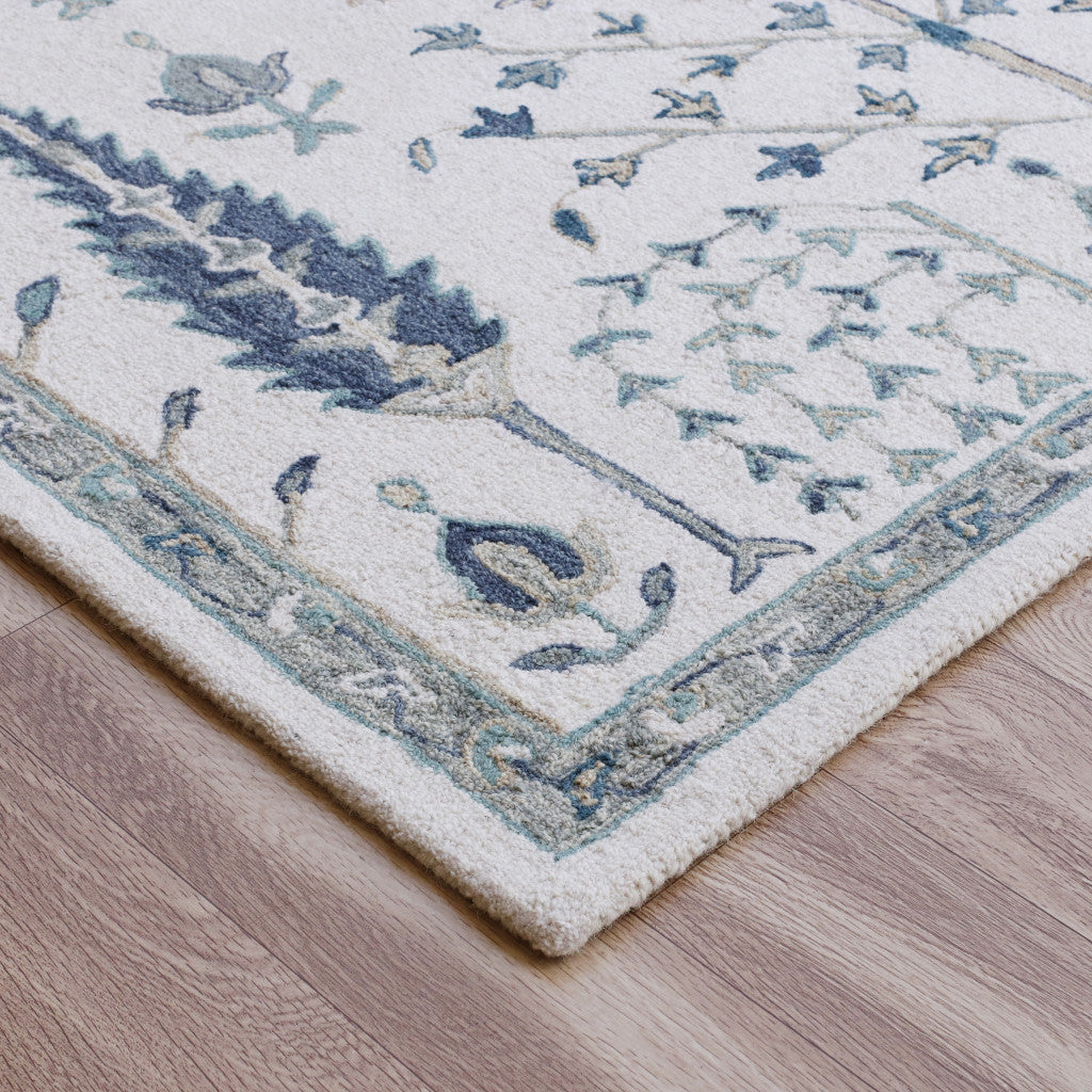 5' x 8' Ivory and Blue Wool Floral Hand Tufted Area Rug