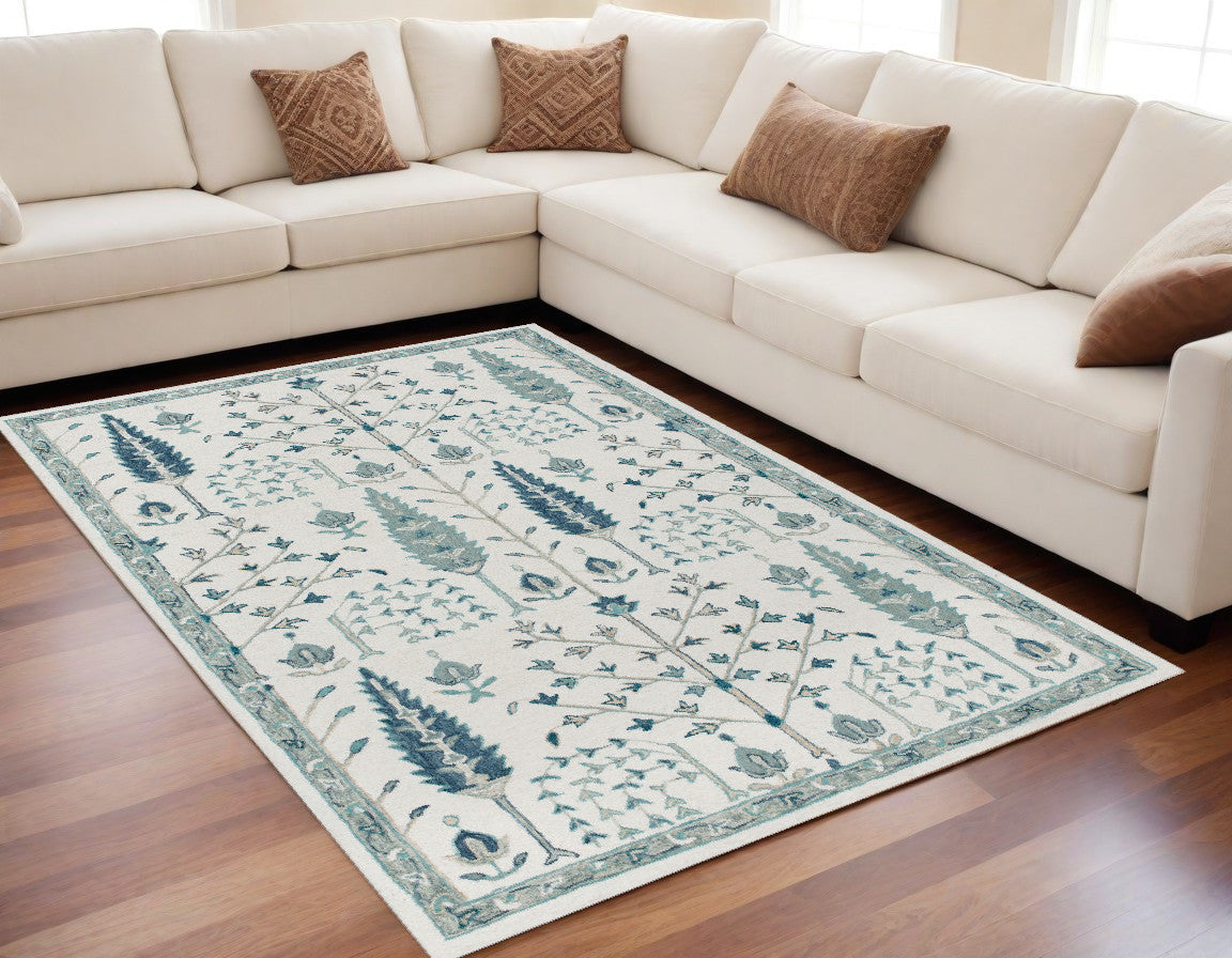 5' x 8' Ivory and Blue Wool Floral Hand Tufted Area Rug
