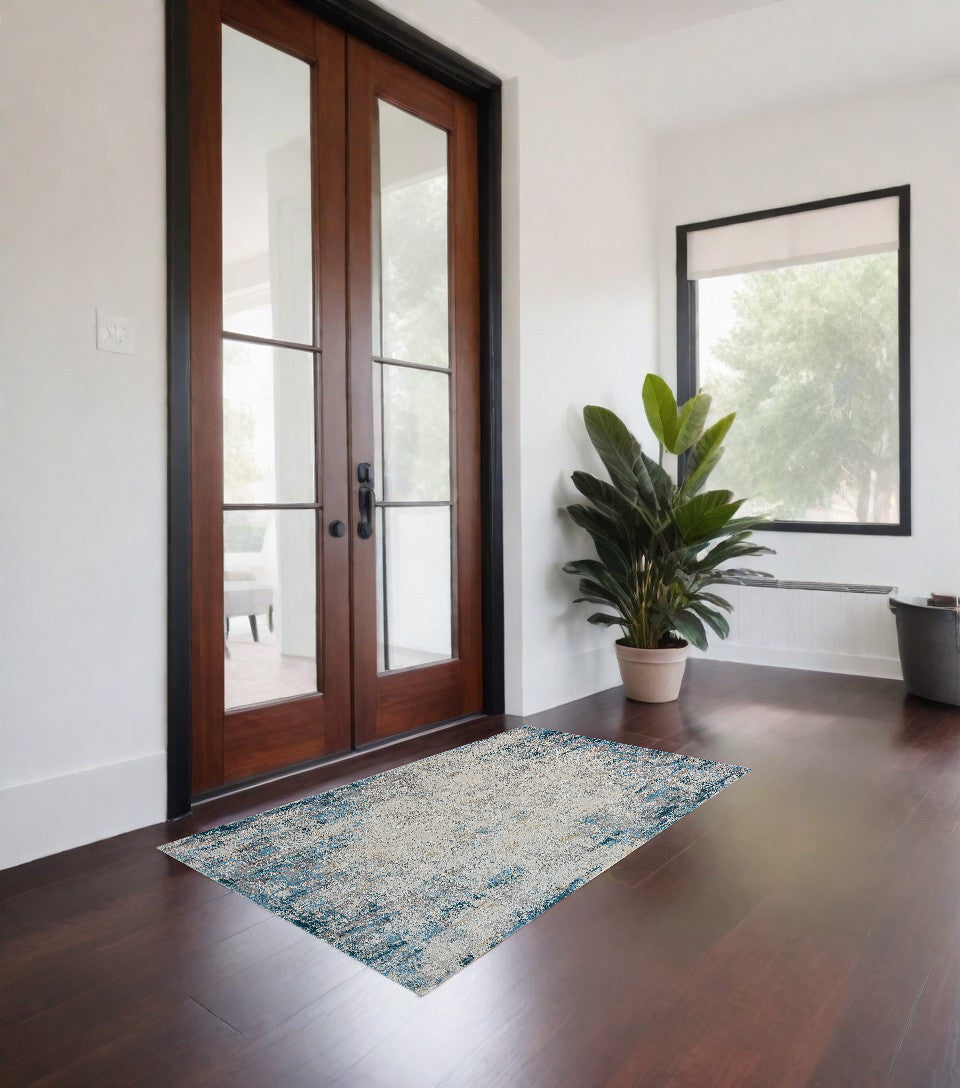 2' x 3' Blue and Ivory Abstract Area Rug