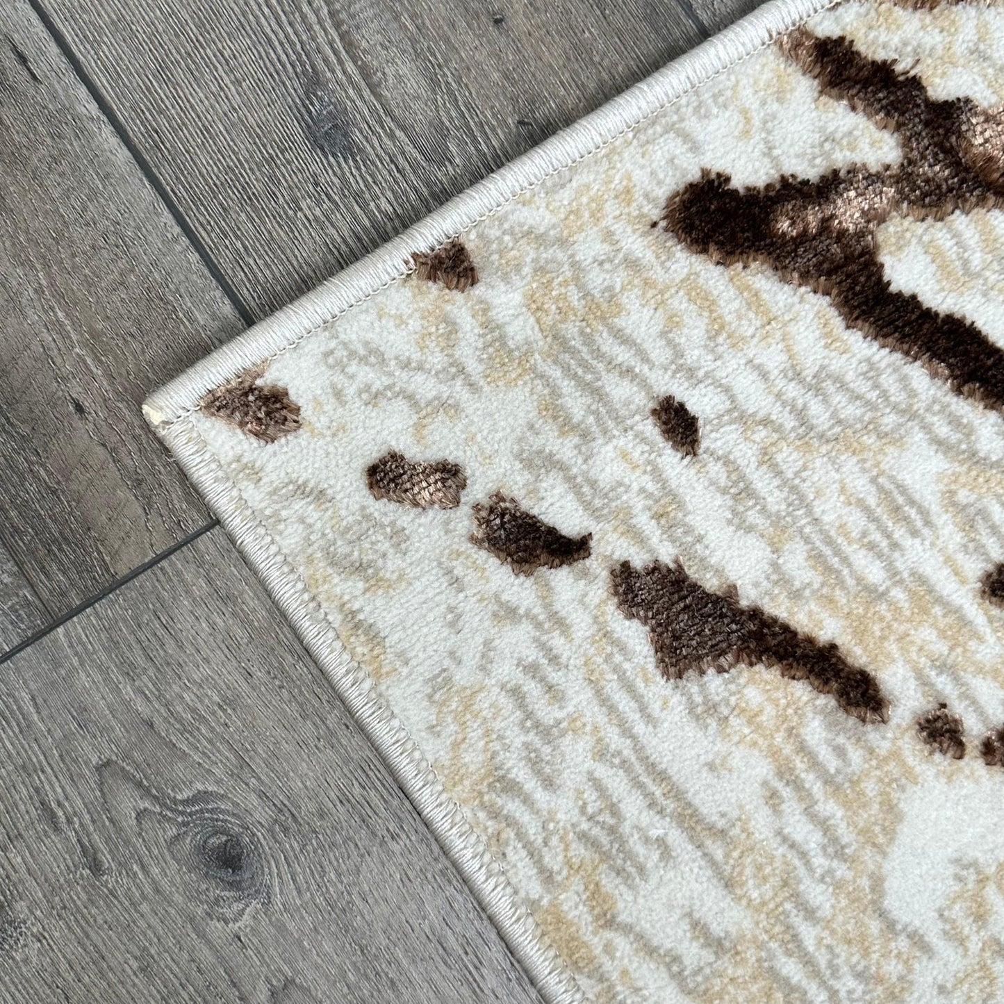 5' x 8' Ivory and Brown Abstract Area Rug