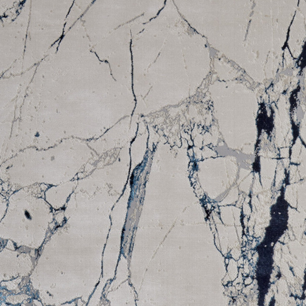8' x 10' Ivory and Blue Marble Power Loom Distressed Area Rug