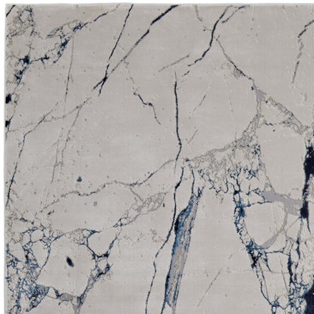 9' x 12' Ivory and Blue Marble Power Loom Distressed Area Rug
