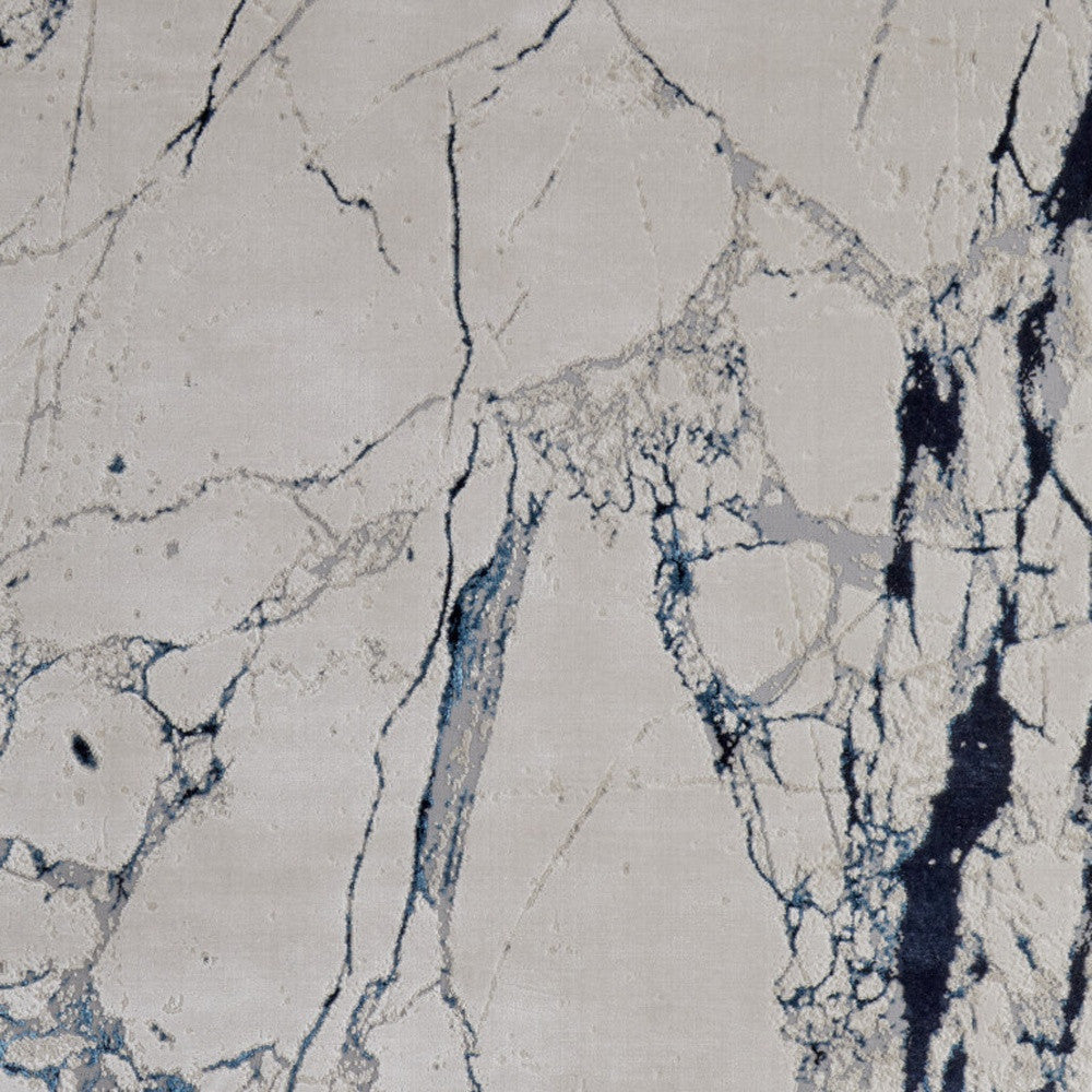4' x 6' Ivory and Blue Marble Power Loom Distressed Area Rug