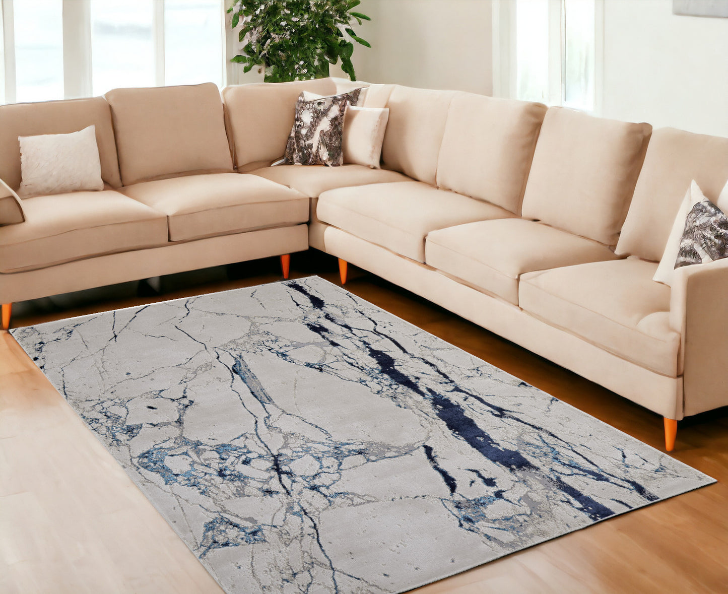7' x 10' Ivory and Blue Marble Power Loom Distressed Area Rug
