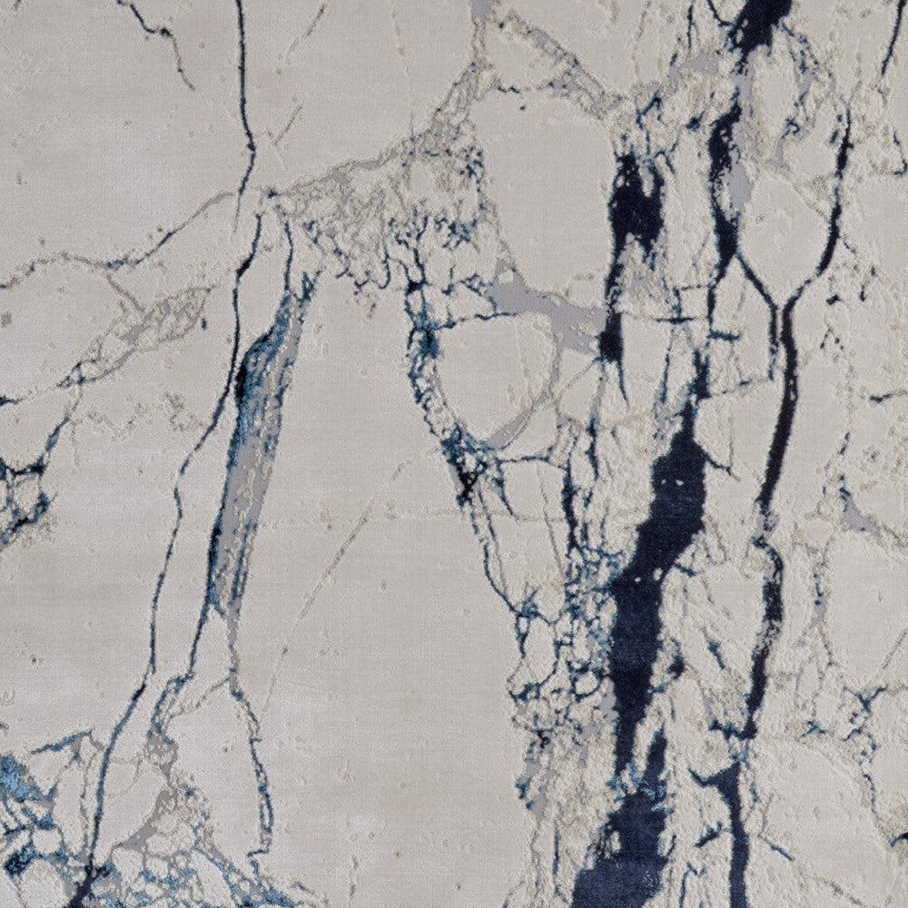 7' x 10' Ivory and Blue Marble Power Loom Distressed Area Rug