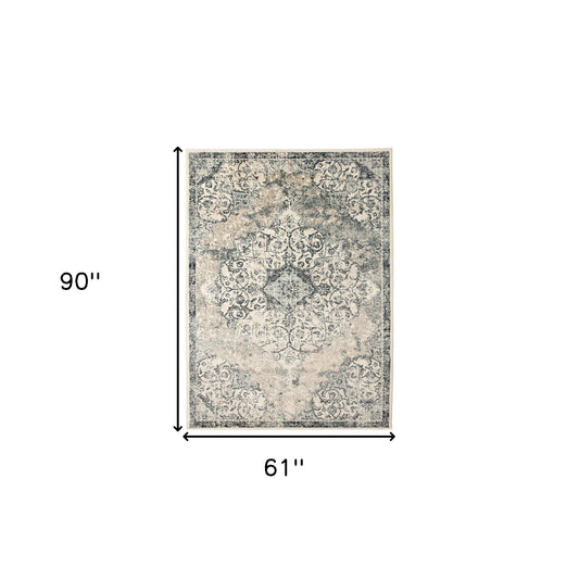 5' x 8' Beige and Blue Medallion Power Loom Area Rug