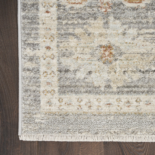 5' x 8' Beige Ivory and Gray Oriental Power Loom Distressed Area Rug With Fringe