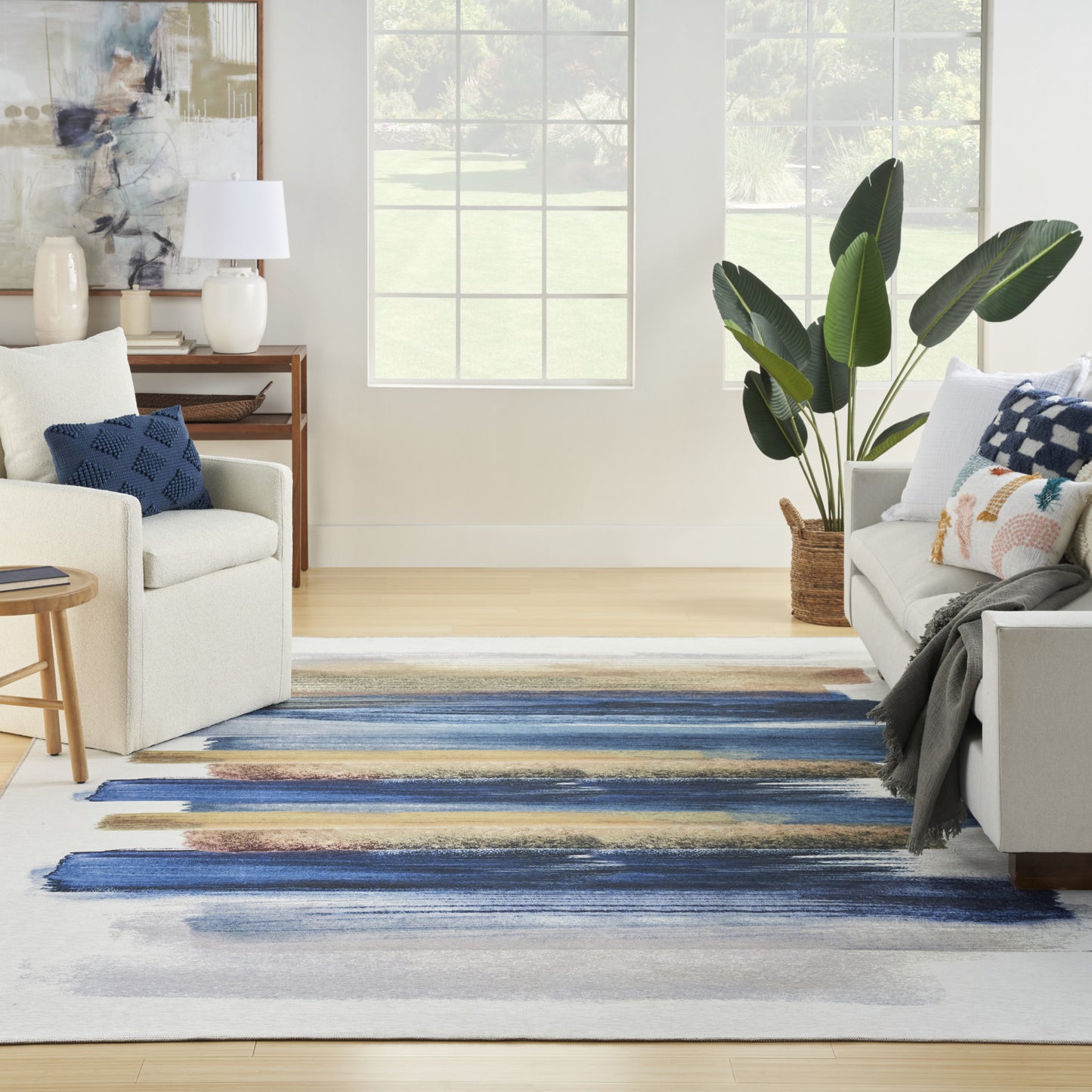 8' x 10' Ivory and Blue Abstract Power Loom Washable Non Skid Area Rug