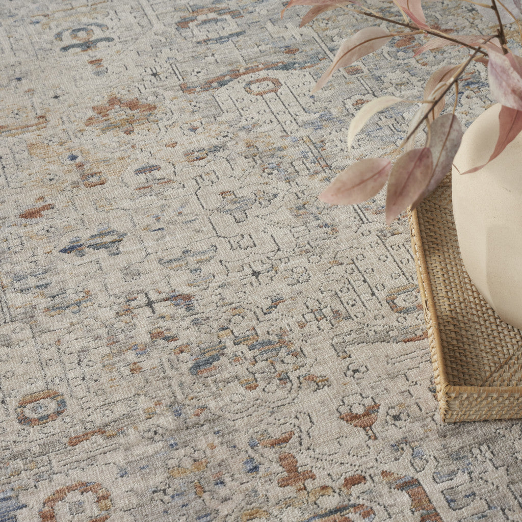 8' x 10' Ivory Blue and Orange Oriental Power Loom Distressed Area Rug With Fringe