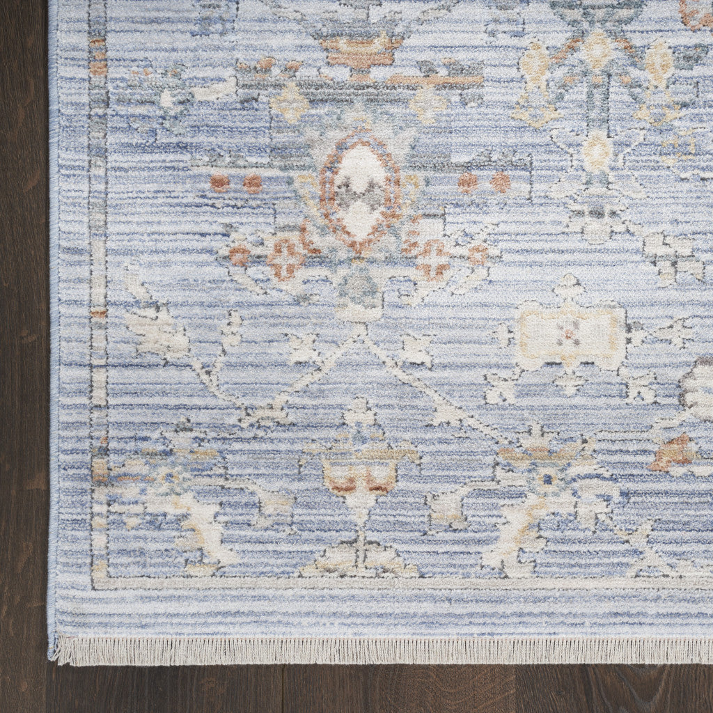 5' x 8' Blue and Ivory Oriental Power Loom Distressed Area Rug With Fringe