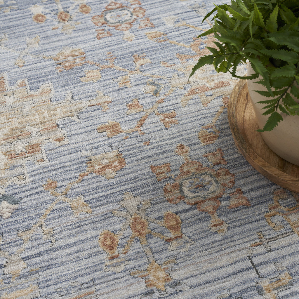 5' x 8' Blue and Ivory Oriental Power Loom Distressed Area Rug With Fringe