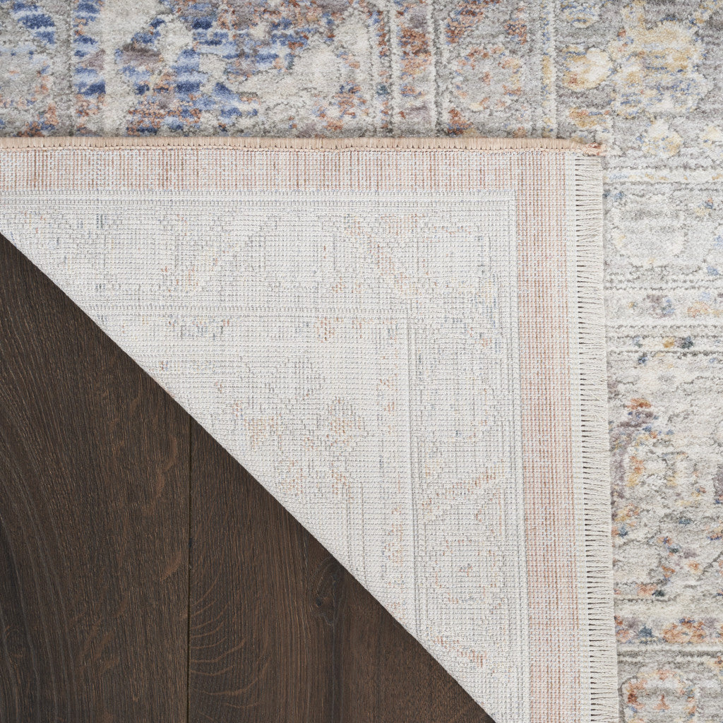 5' x 8' Brown and Blue Oriental Power Loom Distressed Area Rug With Fringe