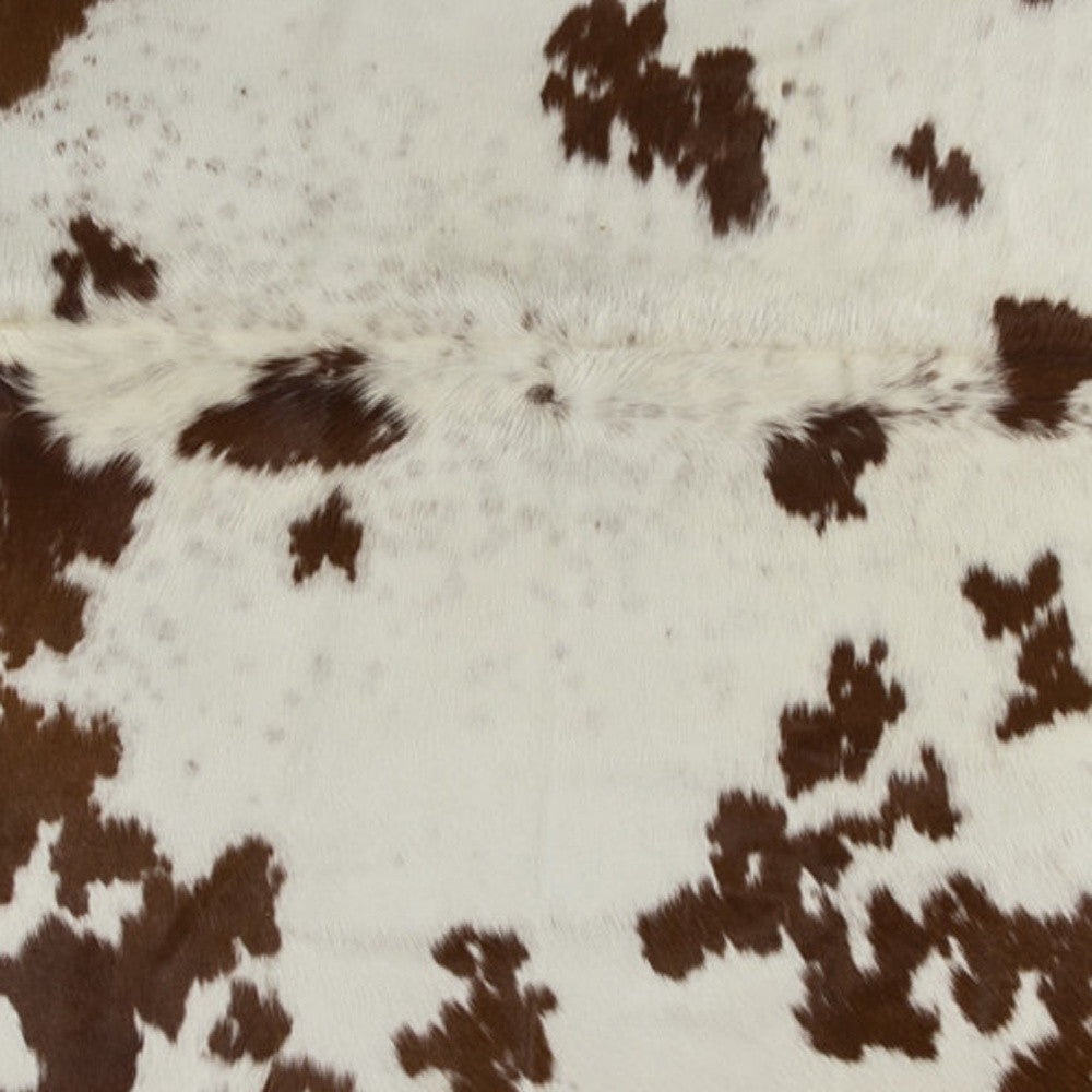 5' x 7' Brown and White Cowhide Hand Knotted Area Rug