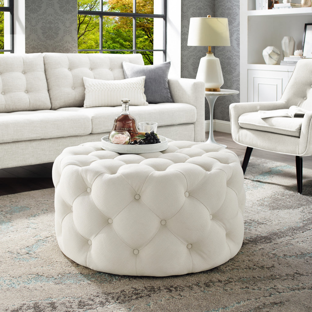 33" White Linen And Black Rolling Tufted Round Cocktail Ottoman