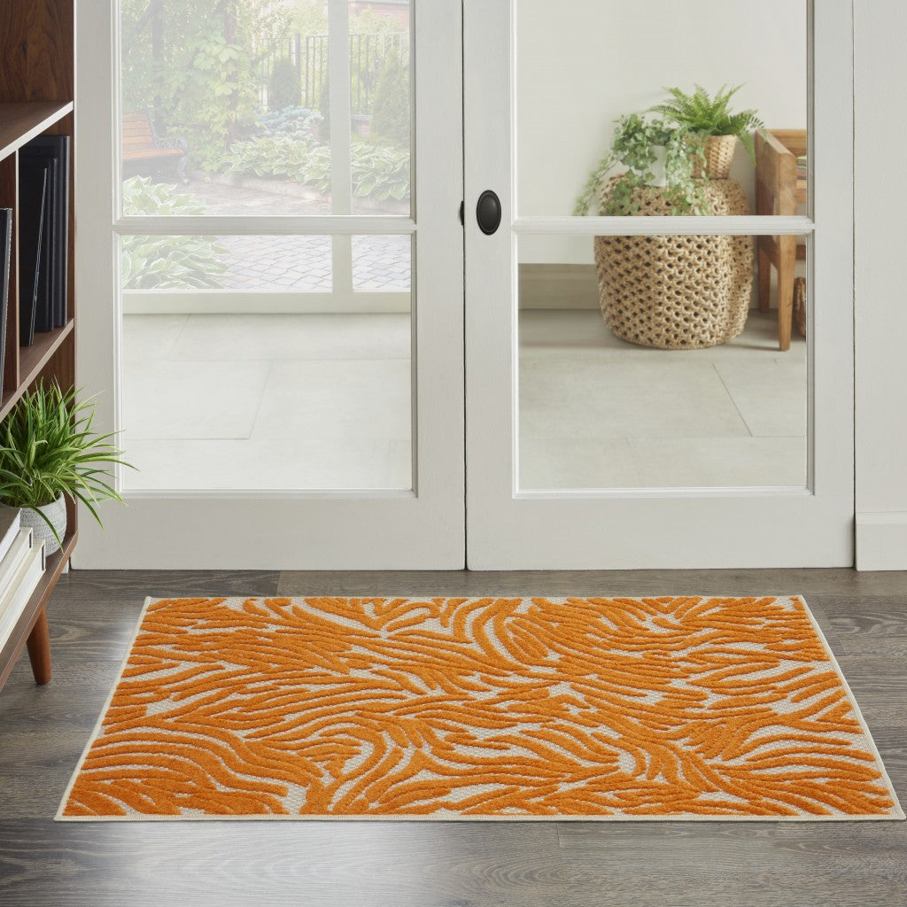 3' X 4' Orange And Ivory Abstract Stain Resistant Indoor Outdoor Area Rug