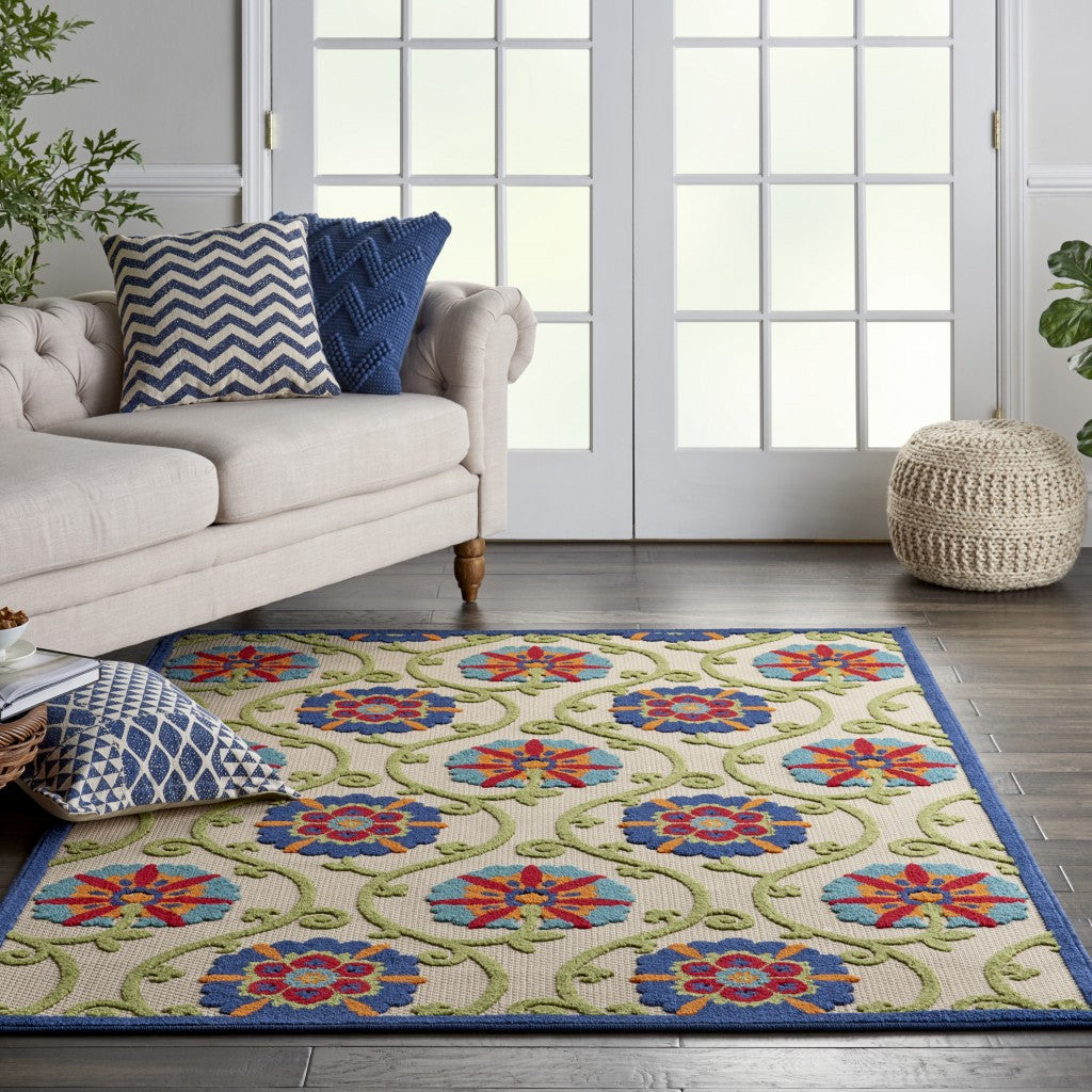 6' X 9' Ivory And Blue Floral Indoor Outdoor Area Rug