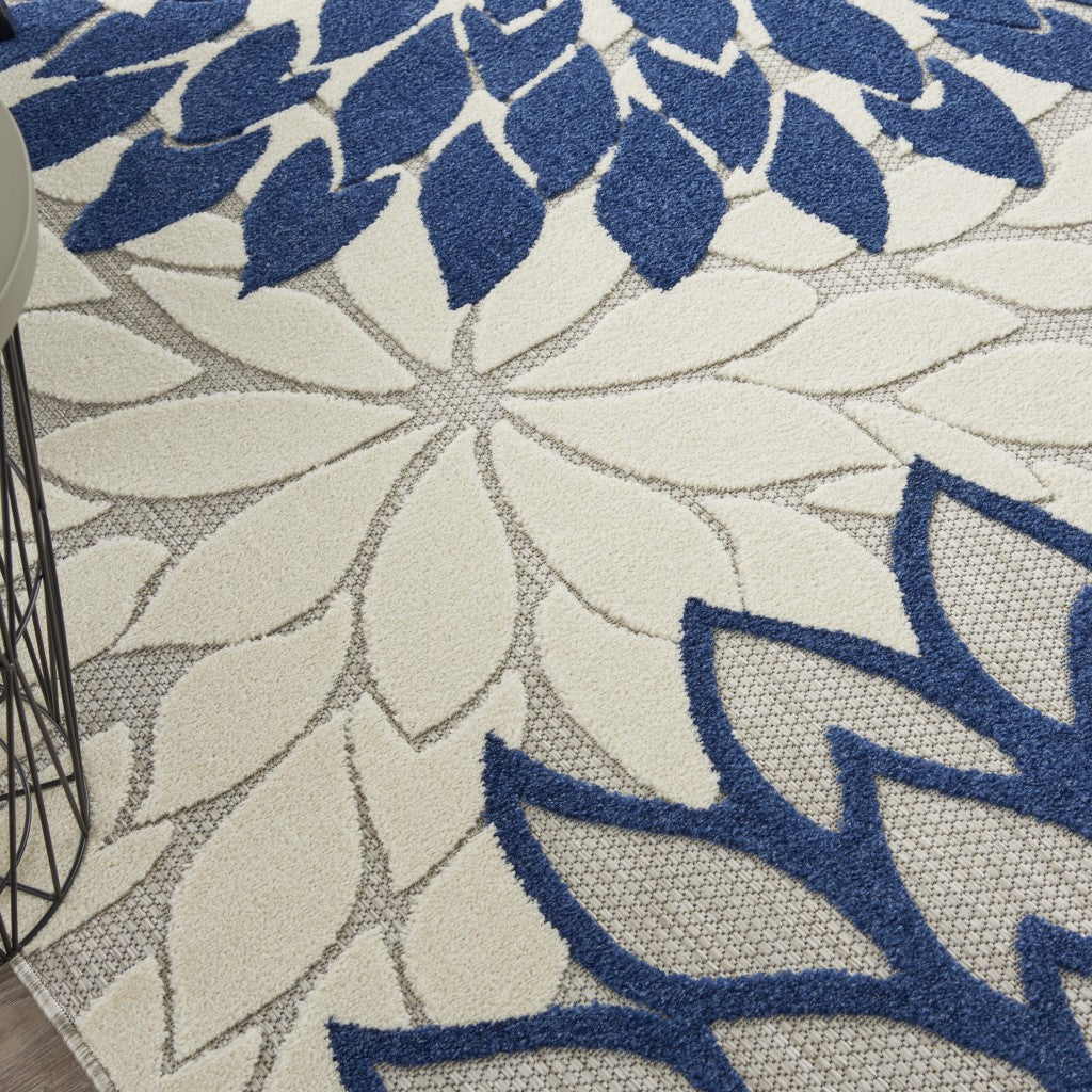 7' X 10' Ivory And Blue Floral Indoor Outdoor Area Rug