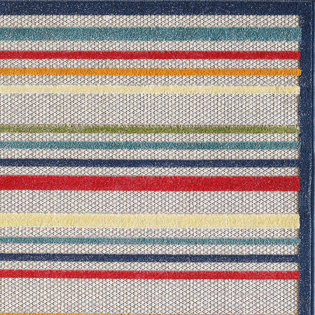 7' X 9' Ivory And Blue Striped Stain Resistant Indoor Outdoor Area Rug