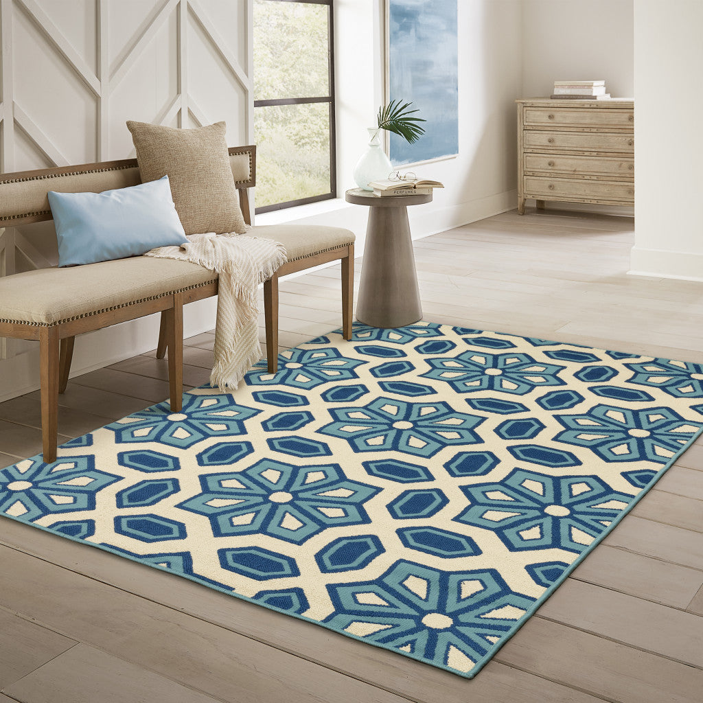 4' x 6' Ivory and Blue Geometric Stain Resistant Indoor Outdoor Area Rug