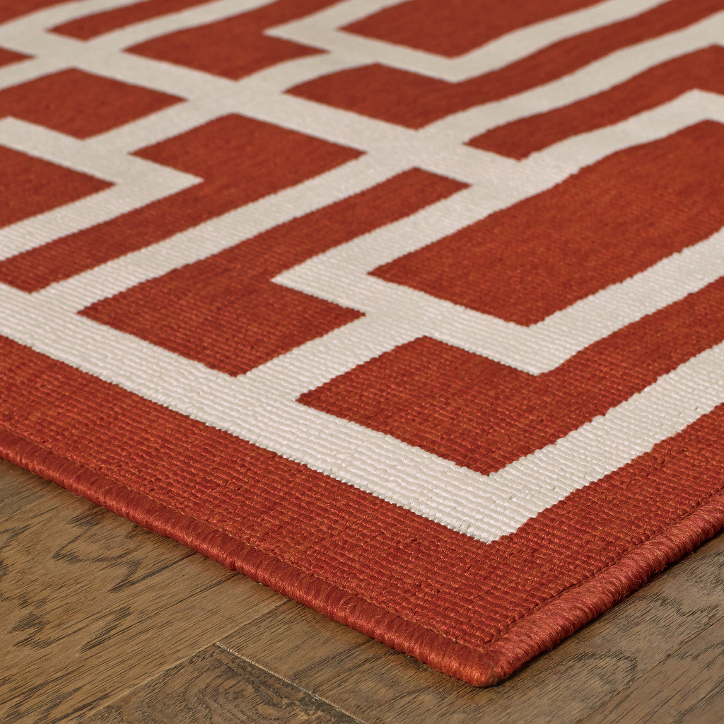 9' X 13' Red and Ivory Geometric Stain Resistant Indoor Outdoor Area Rug