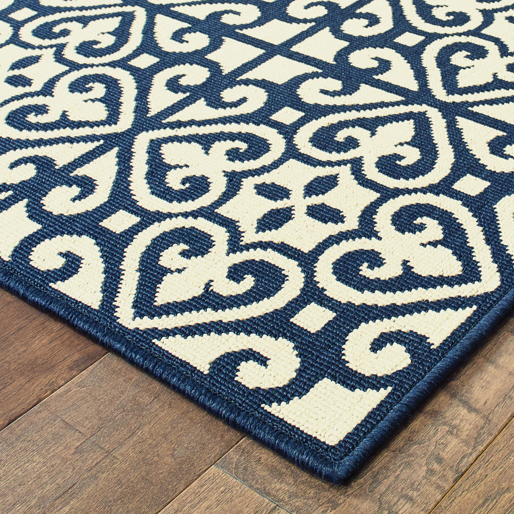 9' X 13' Ivory and Blue Geometric Stain Resistant Indoor Outdoor Area Rug