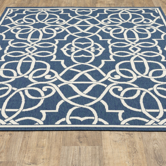 7' x 10' Blue and Ivory Geometric Stain Resistant Indoor Outdoor Area Rug