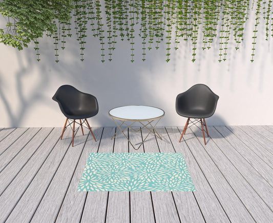 4' x 6' Blue and Ivory Floral Stain Resistant Indoor Outdoor Area Rug