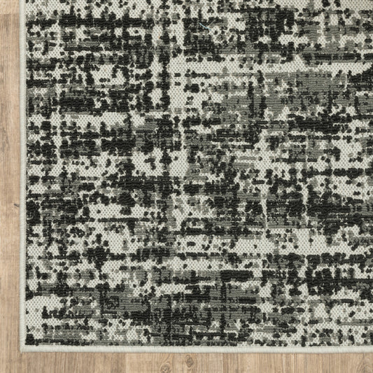 7' x 9' Beige and Black Abstract Stain Resistant Indoor Outdoor Area Rug