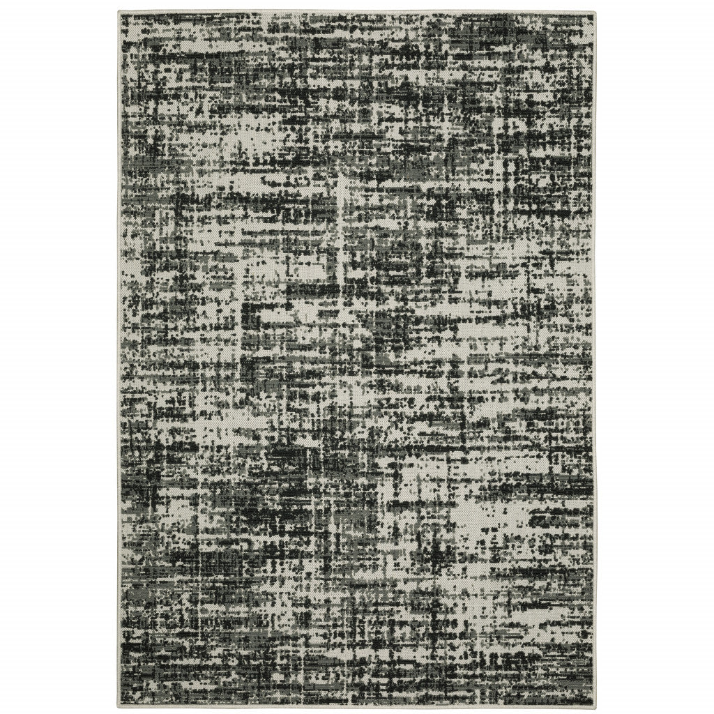 7' x 9' Beige and Black Abstract Stain Resistant Indoor Outdoor Area Rug