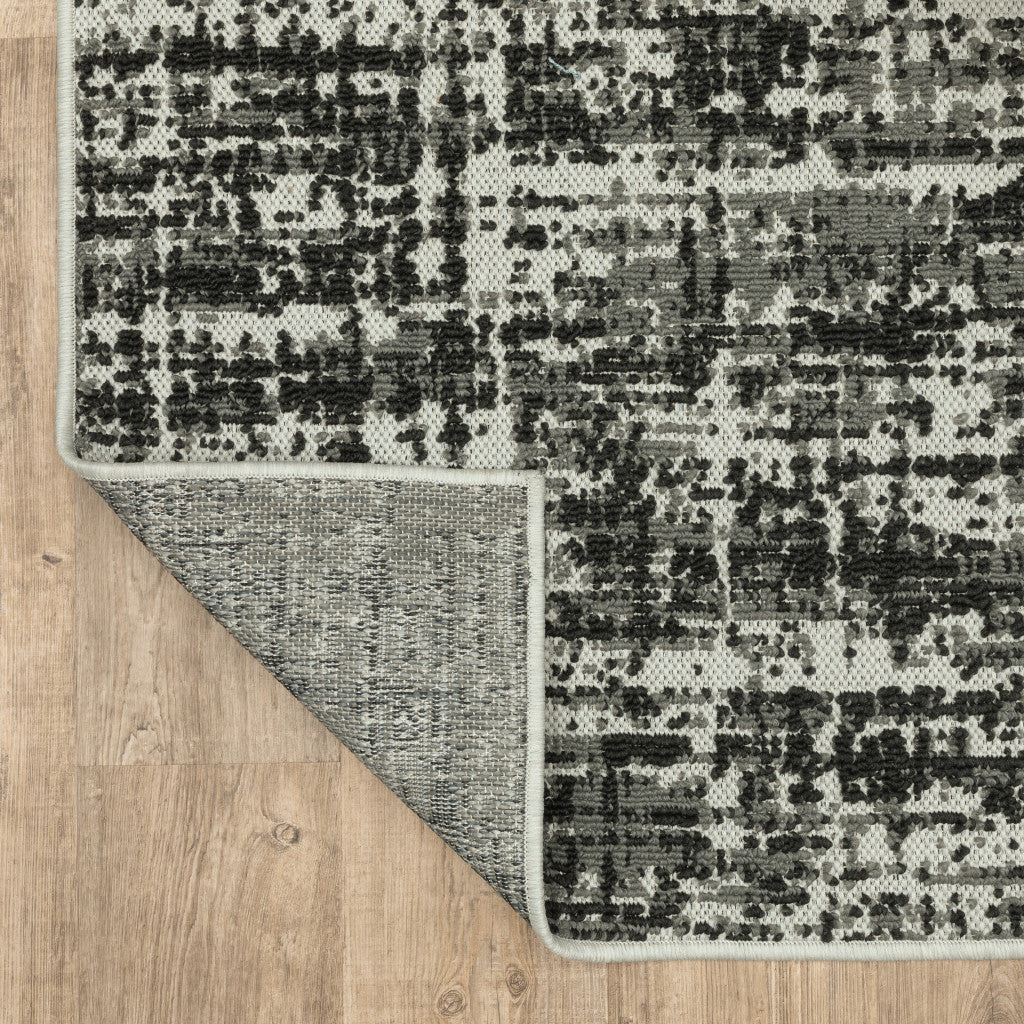 7' x 9' Beige and Black Abstract Stain Resistant Indoor Outdoor Area Rug