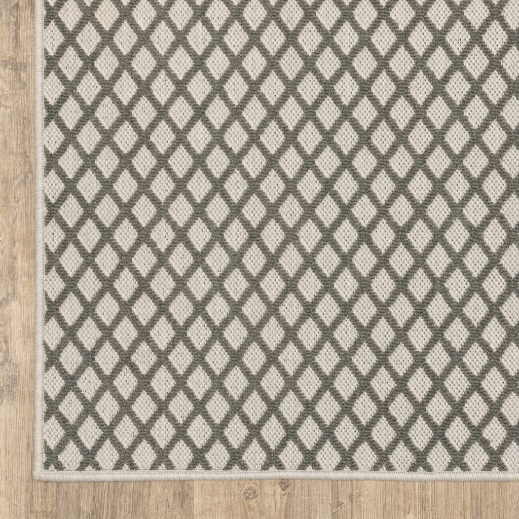 5' x 7' Beige Geometric Stain Resistant Indoor Outdoor Area Rug